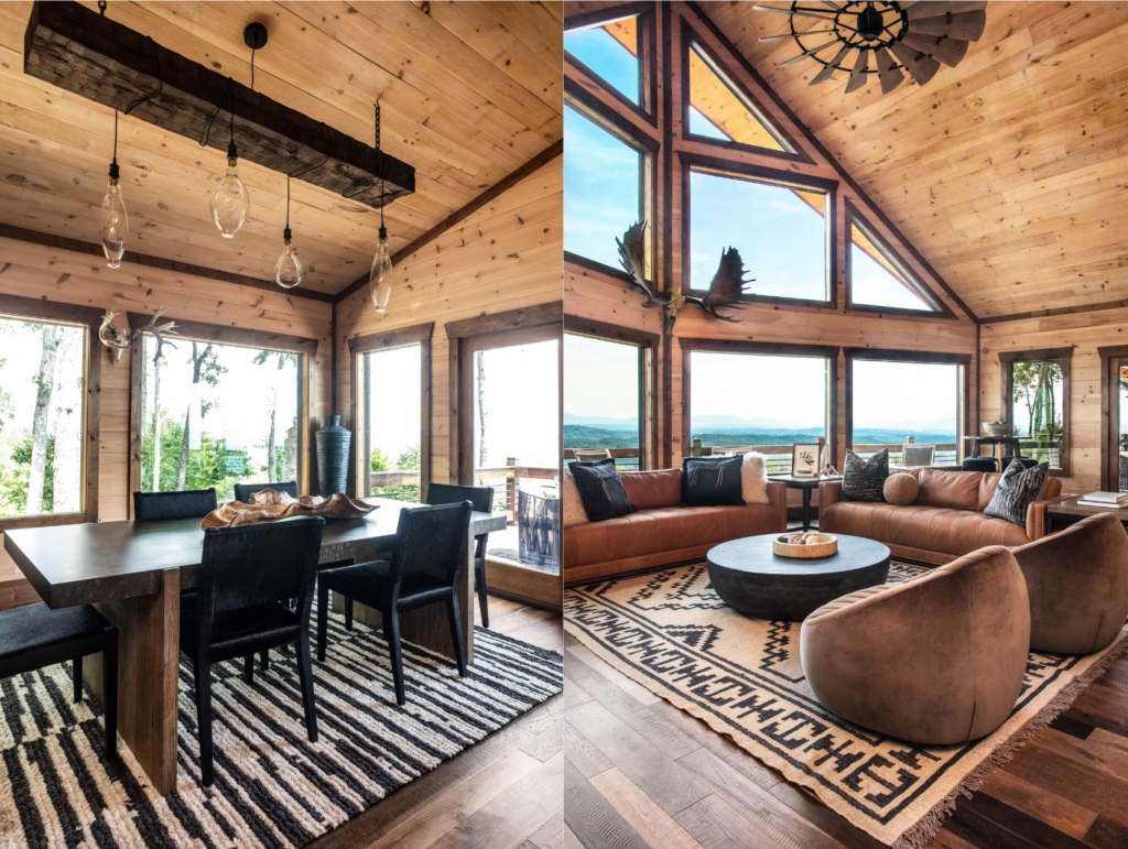 Open-concept cabin living spaces with large oversized windows that look out into the forest and The Blue Ridge Mountains. Glass light fixtures hang over the dining room table.