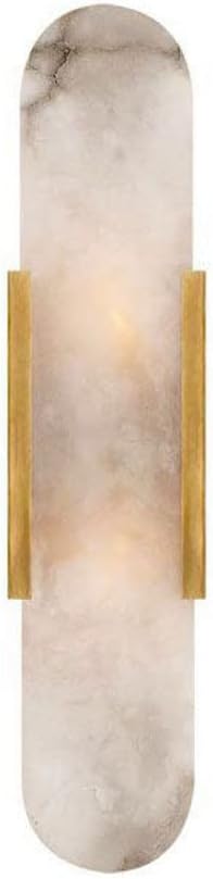 A marble wall sconce with a translucent stone finish and gold metal accents.