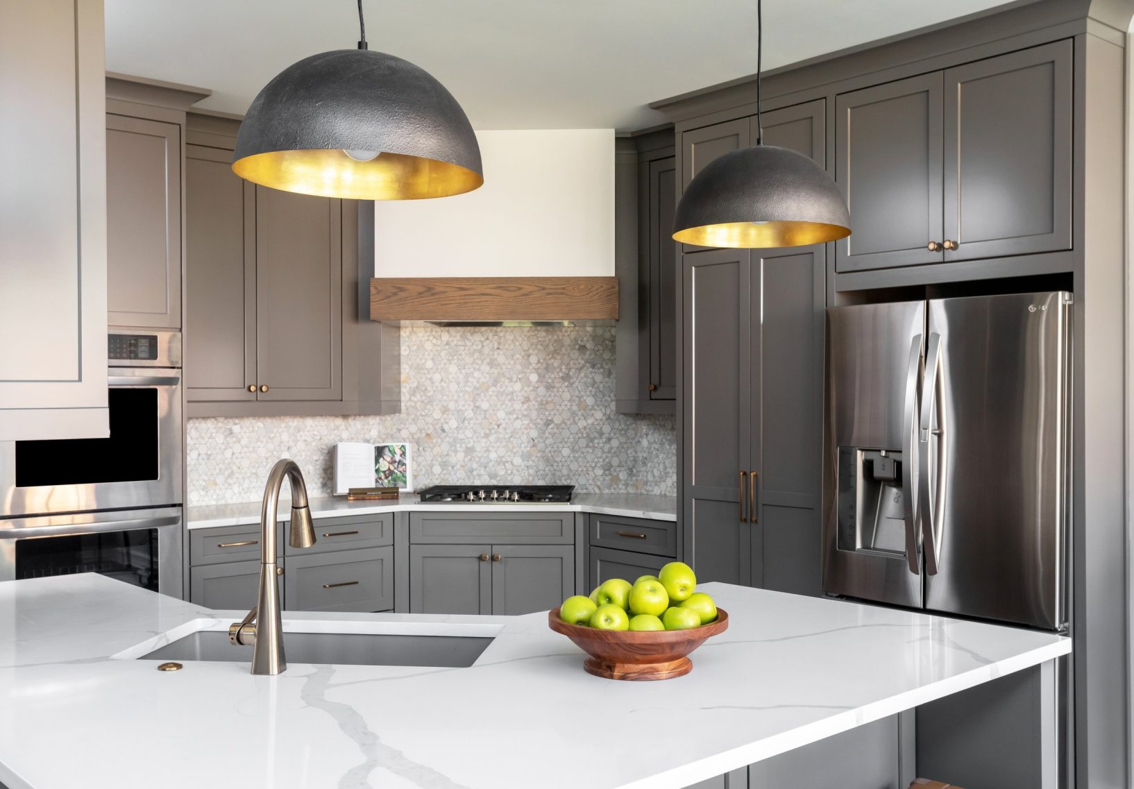Gray, mid-century kitchen with hanging pendant lights.